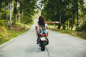 young couple in love, riding a motorcycle, hug, passion, free spirit photo