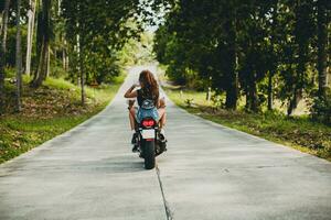 young couple in love, riding a motorcycle, hug, passion, free spirit photo