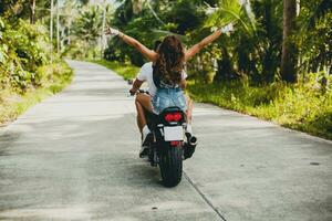 young couple in love, riding a motorcycle, hug, passion, free spirit photo