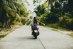 young couple in love, riding a motorcycle, hug, passion, free spirit photo