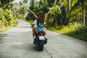 young couple in love, riding a motorcycle, hug, passion, free spirit photo