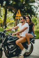 young couple in love, riding a motorcycle, hug, passion, free spirit photo