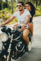 young couple in love, riding a motorcycle, hug, passion, free spirit photo