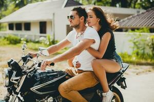 young couple in love, riding a motorcycle, hug, passion, free spirit photo