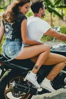 young couple in love, riding a motorcycle, hug, passion, free spirit photo