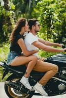 young couple in love, riding a motorcycle, hug, passion, free spirit photo