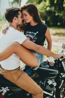 young couple in love, riding a motorcycle, hug, passion, free spirit photo