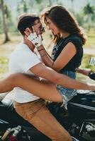 young couple in love, riding a motorcycle, hug, passion, free spirit photo