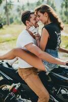 young couple in love, riding a motorcycle, hug, passion, free spirit photo