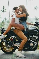 young couple in love, riding a motorcycle, hug, passion, free spirit photo