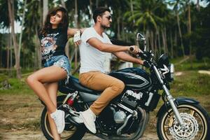 young couple in love, riding a motorcycle, hug, passion, free spirit photo