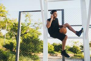 black man doing sports, playing basketball on sunrise, active lifestyle, sunny summer morning photo