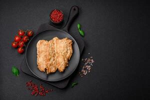 Delicious fried chicken chop or pork meat fried breaded with salt, spices and herbs photo