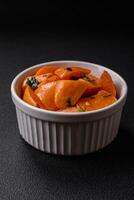 Delicious stewed sweet potato with salt, spices and herbs photo