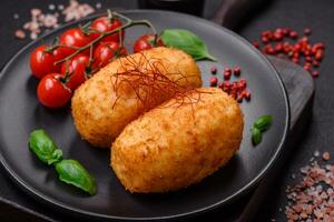 Delicious baked potato cutlet stuffed with chicken and vegetables, spices and salt photo