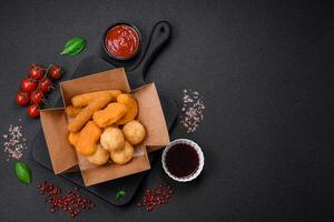 Delicious nuggets, sticks and balls of mozzarella and parmesan cheese with salt and spices photo