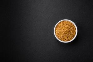 Raw bulgur wheat porridge as an ingredient for preparing a delicious dish photo