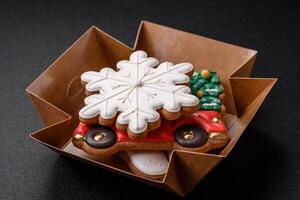 Beautiful festive Christmas gingerbread made by hand with decoration elements photo