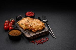 Delicious fried chicken chop or pork meat fried breaded with salt, spices and herbs photo