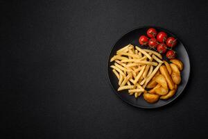 Fresh delicious crispy French fries with salt and spices photo