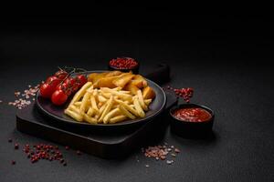 Fresh delicious crispy French fries with salt and spices photo