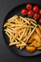 Fresh delicious crispy French fries with salt and spices photo