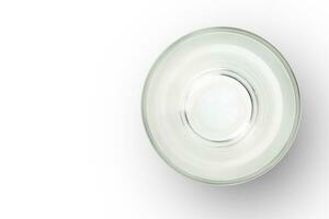 top view of empty glass cup on white background. empty space for design. photo