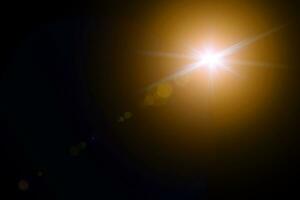 digital lens flare in black background horizontal frame warm photo