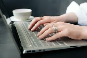 Online Learning and Internet Marketing. Female Hands on Keyboard. Student or Professional. Female Hands Engaged in Online Work. Freelancer's Office. Female Hands on Computer Keyboard. photo