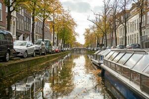 The Netherlands, Delft, October 2022. Canal Oude Delft in Delft canal cruise photo