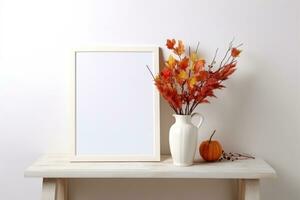 A mock-up of a white empty frame stands on a table with a vase and an autumn bouquet. AI generated photo