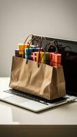 Laptop with shopping bags photo