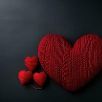 two red knitted hearts photo