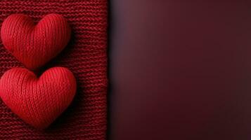 two red knitted hearts photo