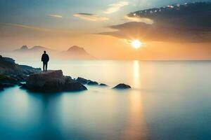 un hombre en pie en un rock en el Oceano a puesta de sol. generado por ai foto