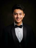 Smiling young man of Asian descent dressed in suit on gray background AI Generative photo