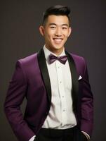 Smiling young man of Asian descent dressed in suit on gray background AI Generative photo