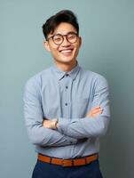 Smiling young man of Asian descent dressed in suit on gray background AI Generative photo