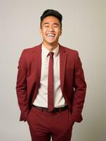 Smiling young man of Asian descent dressed in suit on gray background AI Generative photo