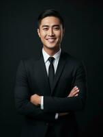 Smiling young man of Asian descent dressed in suit on gray background AI Generative photo