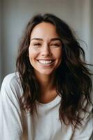 Smiling young woman of Indian descent against neutral background AI Generative photo