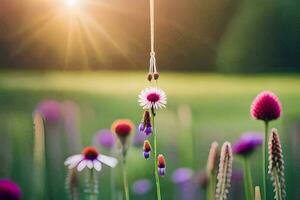 a flower hanging from a string in a field. AI-Generated photo