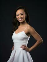 Smiling young woman of Asian descent dressed in elegant dress AI Generative photo