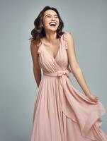 Smiling young woman of Asian descent dressed in elegant dress AI Generative photo