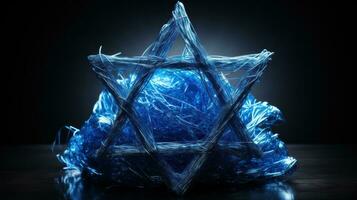 Star of David made of shiny blue tinsel photo