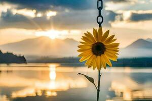 sunflower hanging from a chain in front of a lake. AI-Generated photo