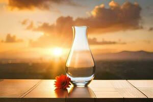 a vase of water and a flower on a table with a sunset in the background. AI-Generated photo