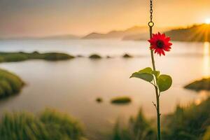 a red flower is hanging from a hook in front of a lake. AI-Generated photo