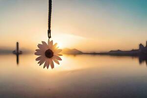 a flower hanging from a rope over a body of water. AI-Generated photo