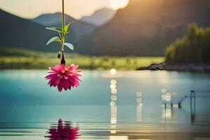 a pink flower hanging from a rope in the water. AI-Generated photo